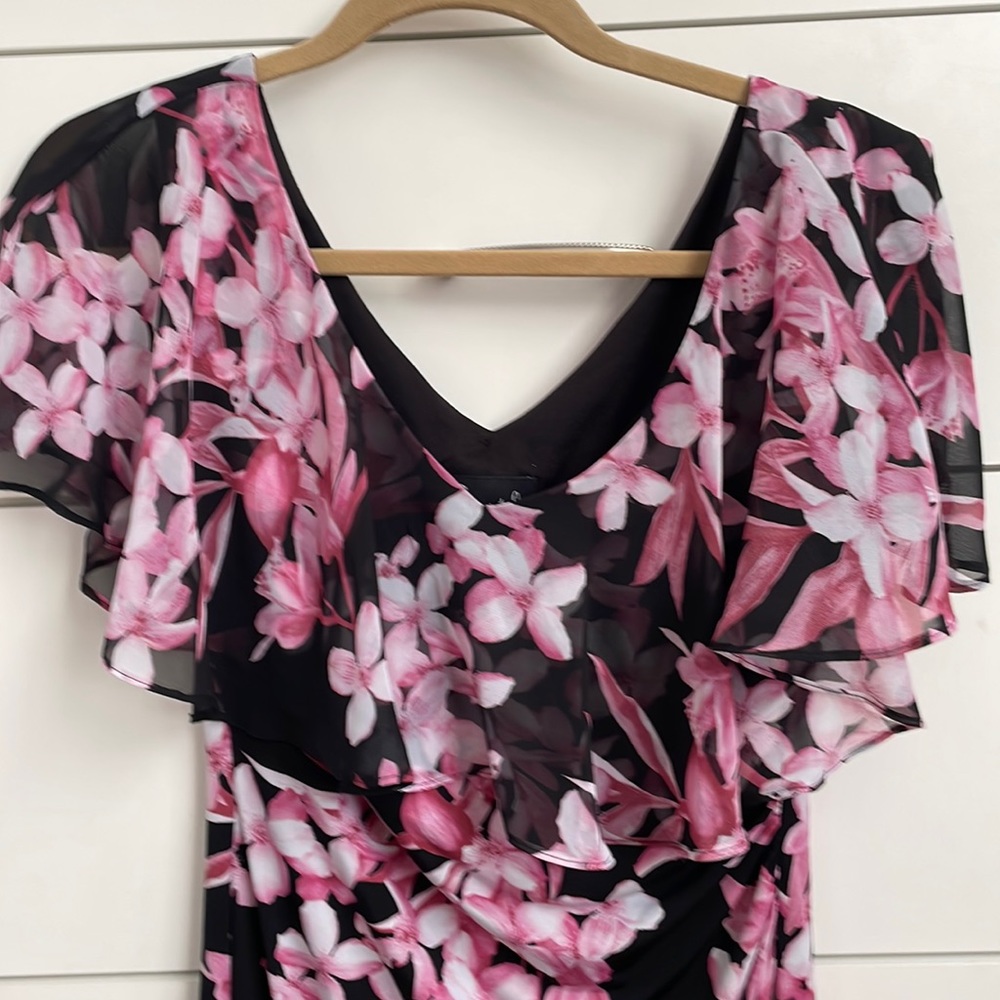 Woman’s dress.  Never worn.  Sleeveless size 4